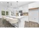 Bright, modern kitchen with a large island, barstool seating, and contemporary finishes at 170 Aspire Cir # 31, Wingate, NC 28174