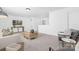 Spacious living room with modern furniture, neutral color palette, and large windows at 170 Aspire Cir # 31, Wingate, NC 28174