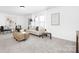 Contemporary living room with comfortable seating, natural light, and modern decor at 170 Aspire Cir # 31, Wingate, NC 28174