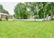 Expansive backyard with lush green grass and mature trees, providing a private and serene outdoor space at 2008 Bantry Ln, Charlotte, NC 28262