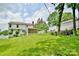 Large backyard with a covered patio, offering ample space for relaxation and entertaining with a level lawn at 2008 Bantry Ln, Charlotte, NC 28262