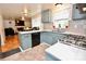 The kitchen features blue cabinets, stainless steel appliances, and tile backsplash at 2008 Bantry Ln, Charlotte, NC 28262