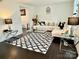 Bright living room features a stylish black and white rug, with upscale lamps, and modern furniture at 2008 Bantry Ln, Charlotte, NC 28262