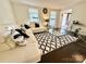 Bright living room features a stylish black and white rug, with upscale lamps, and modern furniture at 2008 Bantry Ln, Charlotte, NC 28262