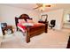 Relaxing main bedroom with dresser, ceiling fan, and desk, offering a personal workspace at 2008 Bantry Ln, Charlotte, NC 28262