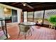 Relaxing screened porch featuring wooden lattice, wood floors and a ceiling fan at 2008 Bantry Ln, Charlotte, NC 28262