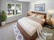 Cozy bedroom with hardwood floors, natural lighting, and a serene ambiance at 2010 Kansas City Dr, Monroe, NC 28110