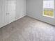 Neutral bedroom with new carpet and closet at 2010 Kansas City Dr, Monroe, NC 28110