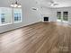 Bright living room with vaulted ceilings, a fireplace, and new hardwood flooring at 2010 Kansas City Dr, Monroe, NC 28110