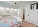 Large carpeted bedroom with white trim and ceiling fan also has a view into the ensuite at 2032 Greenbrook Pkwy, Matthews, NC 28104