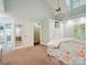 Spacious carpeted bedroom features a ceiling fan, white trim, and ensuite bathroom at 2032 Greenbrook Pkwy, Matthews, NC 28104