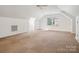 Bonus room with skylight, window, neutral paint, carpet tiles and ceiling fan at 2032 Greenbrook Pkwy, Matthews, NC 28104