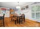 Cozy dining area with a wooden table, chairs, bench, and unique wall decor creating a welcoming atmosphere at 2032 Greenbrook Pkwy, Matthews, NC 28104