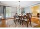 The dining room includes a large wooden table and chairs set on a beautiful rug at 2032 Greenbrook Pkwy, Matthews, NC 28104