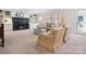 Comfortable living room featuring a cozy fireplace, built-in bookshelves, and ample seating at 2032 Greenbrook Pkwy, Matthews, NC 28104