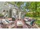 Inviting backyard patio area with cozy seating and brick paving, perfect for outdoor relaxation at 2034 Lanier Ave, Charlotte, NC 28205