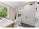 Modern bathroom with glass-enclosed shower, black hardware, and designer tile at 2034 Lanier Ave, Charlotte, NC 28205