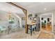Dining area with accent beam, modern chandelier, eat-in table and natural light at 2034 Lanier Ave, Charlotte, NC 28205