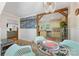 Open floor plan with dining area with modern chandelier, accent beam, and access to kitchen at 2034 Lanier Ave, Charlotte, NC 28205