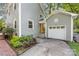 Charming home exterior featuring a garage, landscaped yard, and inviting curb appeal, showcasing quality craftsmanship at 2034 Lanier Ave, Charlotte, NC 28205