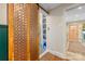 Hallway featuring a sliding decorative door with access to a laundry room at 2034 Lanier Ave, Charlotte, NC 28205