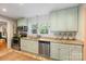 Charming kitchen features mint cabinetry, granite countertops, stainless steel appliances, and a window view at 2034 Lanier Ave, Charlotte, NC 28205