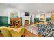 Well-lit living room with hardwood floors, fireplace, accent walls, and elegant furnishings at 2034 Lanier Ave, Charlotte, NC 28205