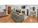 Comfortable living room with hardwood floors, fireplace, and access to the staircase and bedroom at 2034 Lanier Ave, Charlotte, NC 28205