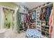 Spacious walk-in closet with organized shelving and storage for clothes, shoes, and accessories at 2034 Lanier Ave, Charlotte, NC 28205