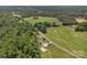 Beautiful aerial shot showcases a private estate with rolling green fields and tree-lined boundaries at 247 Helton Rd, Cherryville, NC 28021