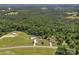 Expansive aerial view of a home with a pool, surrounded by lush greenery and ample land at 247 Helton Rd, Cherryville, NC 28021