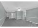 Spacious basement area featuring neutral paint, plush carpeting and recessed lighting at 247 Helton Rd, Cherryville, NC 28021