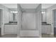 Bright bathroom featuring a shower/tub combination and double vanity with granite countertops at 247 Helton Rd, Cherryville, NC 28021