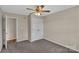 Neutral bedroom with a large closet, fan, and doorway at 247 Helton Rd, Cherryville, NC 28021