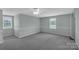 Large bonus room with carpet, natural light and chair rail at 247 Helton Rd, Cherryville, NC 28021