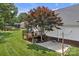 This is a view of the backyard deck, made of wood, with a brick foundation, and a mature tree at 247 Helton Rd, Cherryville, NC 28021