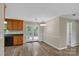 Bright dining area with access to outdoor deck via French doors and view of kitchen at 247 Helton Rd, Cherryville, NC 28021