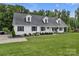 This is a side view of the home, with a manicured lawn, mature trees, and a long driveway at 247 Helton Rd, Cherryville, NC 28021