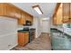 Traditional kitchen with wood cabinets, stainless steel appliances, and green countertops at 247 Helton Rd, Cherryville, NC 28021