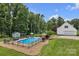 Private in-ground pool with an enclosed fence and well-kept backyard at 247 Helton Rd, Cherryville, NC 28021