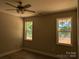 Well-lit bedroom with natural light, two windows offering verdant views, and clean, modern finishes at 2560 S Jake Alexander S Blvd, Salisbury, NC 28146