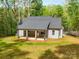 Aerial view of a single Gathering home featuring a back porch at 292 Manchester Rd, Mount Gilead, NC 27306