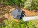 Stunning aerial view of a home with a modern roof design, set amidst lush greenery and a private driveway at 292 Manchester Rd, Mount Gilead, NC 27306