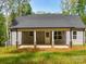 Charming home with a back porch overlooking a lush green lawn at 292 Manchester Rd, Mount Gilead, NC 27306