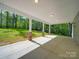 Covered back porch with stately columns overlooking a lush green lawn at 292 Manchester Rd, Mount Gilead, NC 27306