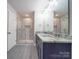 Bathroom features dual vanity, granite countertops, and a tiled walk-in shower at 292 Manchester Rd, Mount Gilead, NC 27306