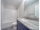 Neutral bathroom features a modern vanity with granite countertop and walk-in shower at 292 Manchester Rd, Mount Gilead, NC 27306