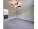 A neutral bedroom with a ceiling fan and carpet flooring awaits personal touches at 292 Manchester Rd, Mount Gilead, NC 27306