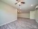 Bright bonus room features gray vinyl floors, a ceiling fan, and mini split at 292 Manchester Rd, Mount Gilead, NC 27306