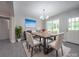 Modern dining room with stylish table set under a chandelier, complemented by an adjacent outdoor view at 292 Manchester Rd, Mount Gilead, NC 27306